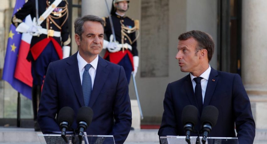 French President Emmanuel Macron and Greek Prime Minister Kyriakos Mitsotakis deliver a joint statement before a meeting at the Elysee Palace in Paris