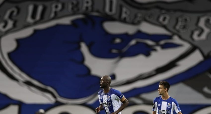 epa08548612 FC Porto's Danilo Pereira (L) celebrates after scoring a goal against Sporting during the Portuguese First League soccer match between FC Porto and Sporting CP held at Dragao stadium in Porto, Portugal, 15 July 2020.  EPA/JOSE COELHO