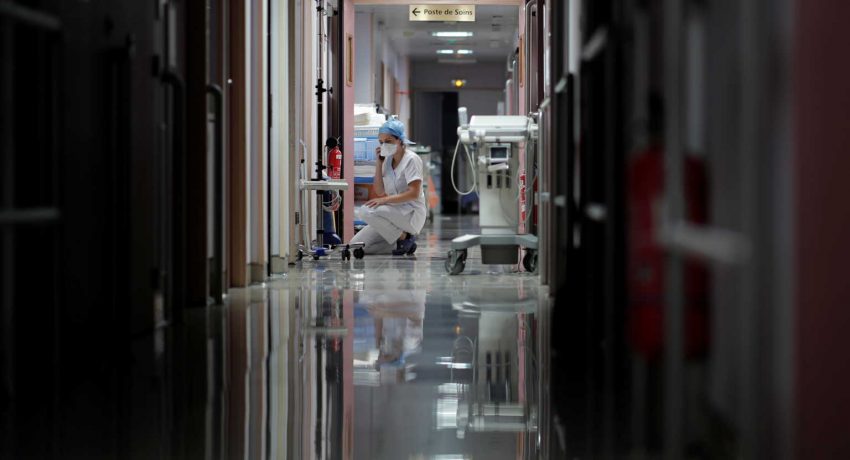 A medical staff member works in the Intensive Care Unit (ICU) where patients suffering from the coronavirus disease (COVID-19) are treated at Ambroise Pare clinic in Neuilly-sur-Seine, near Paris, France, November 12, 2020. REUTERS/Benoit Tessier