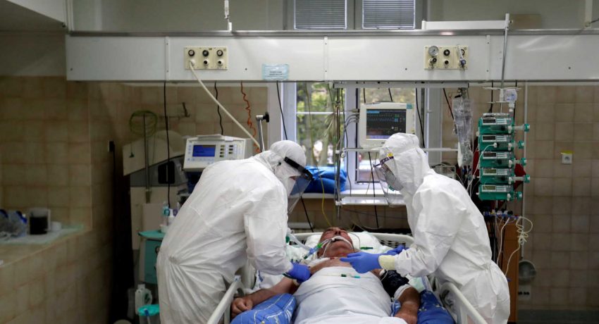 FILE PHOTO: Members of the medical staff treat a patient suffering from the coronavirus disease (COVID-19) at the Intensive Care Unit (ICU) of the Slany Hospital in Slany, Czech Republic, October 13, 2020. REUTERS/David W Cerny/File Photo