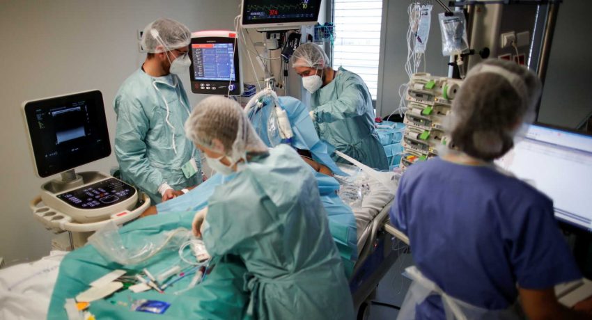 Medical staff members work in the Intensive Care Unit (ICU) where patients suffering from the coronavirus disease (COVID-19) are treated at the Melun-Senart hospital, near Paris, France, October 30, 2020. REUTERS/Benoit Tessier