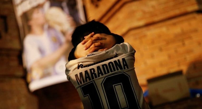 Five years old Inaki Gonzalez Reynoso, who was born in Argentina, participates on a tribute to late Argentine soccer legend Diego Armando Maradona the day after his death, in Barcelona, Spain, November 26, 2020.  REUTERS/Nacho Doce