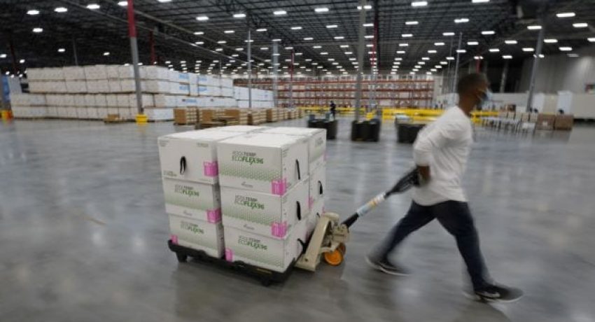Boxes containing the Moderna COVID-19 vaccine are prepared to be shipped at the McKesson distribution center in Olive Branch, Mississippi, U.S. December 20, 2020. Paul Sancya/Pool via REUTERS
