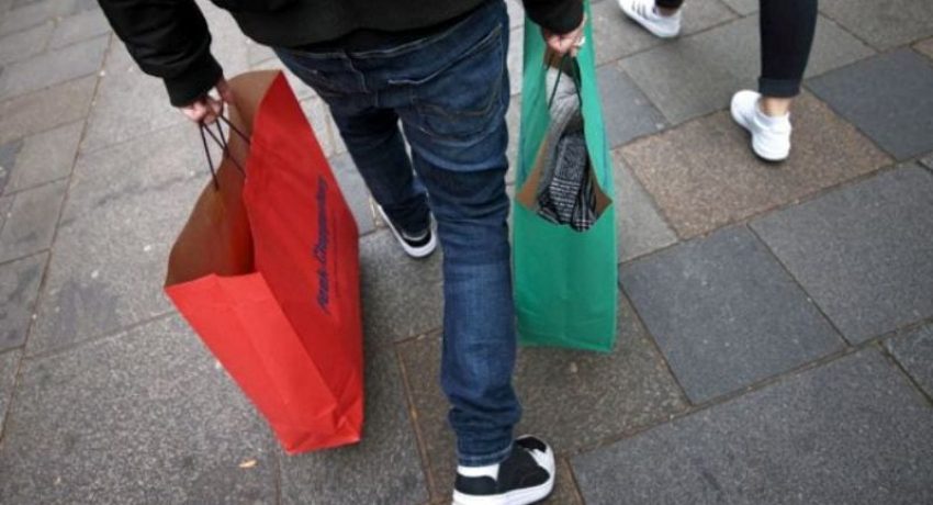 A person carries shopping bags as the Austrian government is due to announce a lockdown including the closure of all non-essential shops, as the spread of the coronavirus disease (COVID-19) continues, in Vienna, Austria November 14, 2020. REUTERS/Lisi Niesner