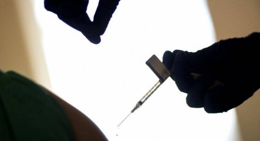 A droplet falls from a syringe after a health care worker was injected with the Pfizer-BioNTech COVID-19 vaccine at Women & Infants Hospital in Providence, R.I., Tuesday, Dec. 15, 2020. (AP Photo/David Goldman)