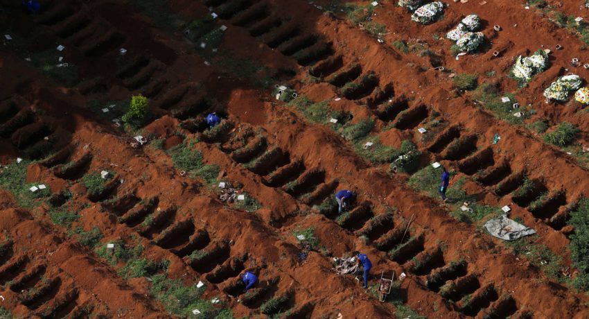 FILE PHOTO: Gravediggers open new graves as the number of dead rose amid the coronavirus outbreak, at Vila Formosa cemetery, Brazil's biggest cemetery, in Sao Paulo, April 2. REUTERS/Amanda Perobelli/File Photo