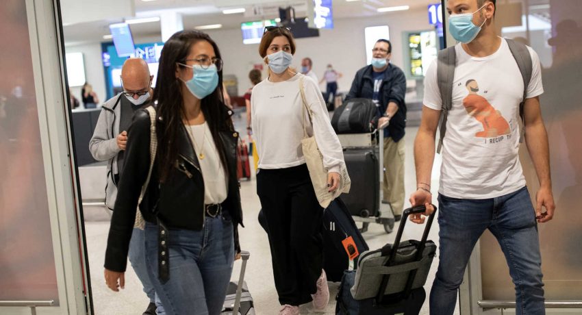 Passengers of a flight from Paris wearing protective face masks arrive at the Eleftherios Venizelos International Airport, following the easing of measures against the spread of coronavirus disease (COVID-19), in Athens, Greece, June 15, 2020. REUTERS/Alkis Konstantinidis