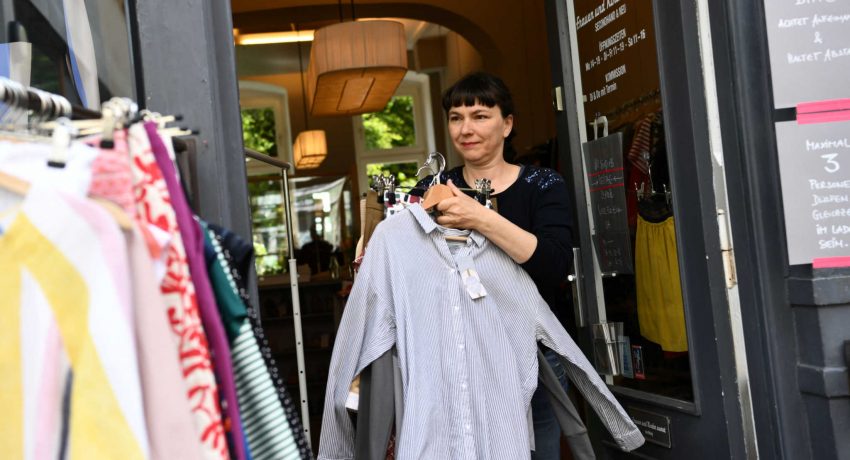 Babette Schumacher, saleswomen of the clothing store ''Frauen und Kinder zuerst'', opens the store, as the spread of the coronavirus disease (COVID-19) continues, in Berlin, Germany, April 25, 2020.  REUTERS/Annegret Hilse
