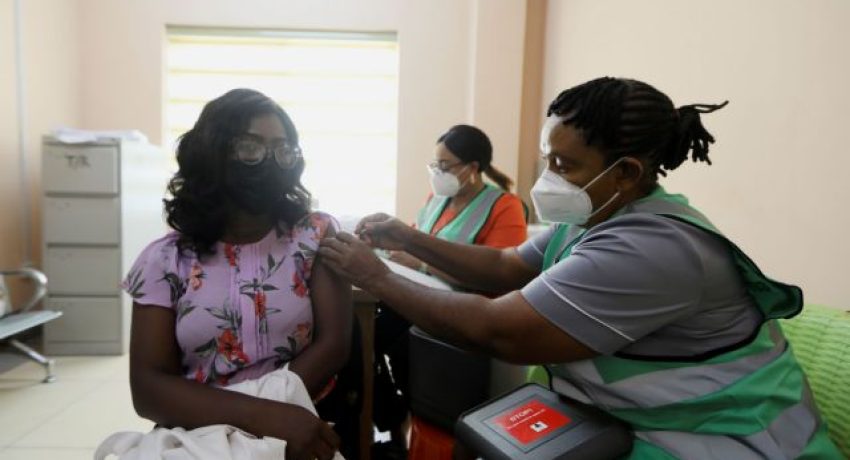 FILE PHOTO: A person receives a dose of the Oxford/AstraZeneca coronaviru vaccine at the National hospital in Abuja, Nigeria, March 5, 2021. REUTERS/Afolabi Sotunde/File Photo