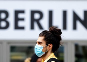 A man wearing a face mask is pictured at Schloss Strasse shopping street, as the coronavirus disease (COVID-19) outbreak continues, in Berlin, Germany, October 20, 2020. REUTERS/Fabrizio Bensch