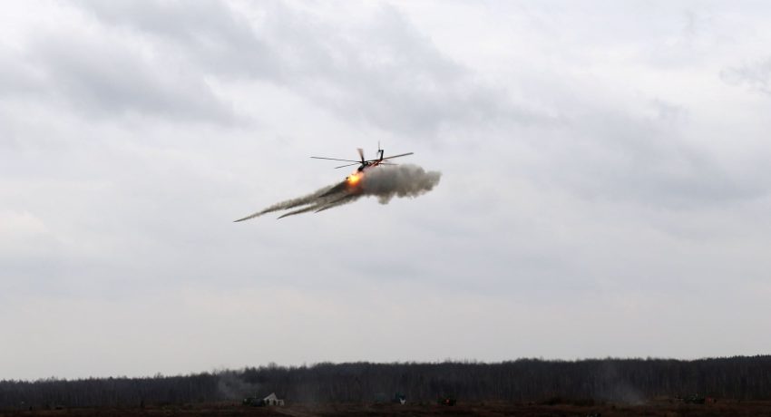 A helicopter fires missiles during military drills of the Ukrainian Air Assault Forces in Zhytomyr Region, Ukraine November 21, 2021. Picture taken November 21, 2021. Press service of the Ukrainian Air Assault Forces Command/Handout via REUTERS ATTENTION EDITORS - THIS IMAGE HAS BEEN SUPPLIED BY A THIRD PARTY.