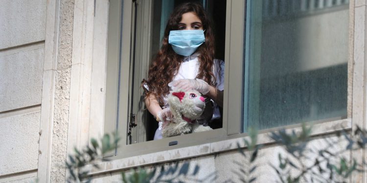 A Lebanese girl, who was stranded abroad by coronavirus lockdowns is quarantined at a hotel while awaiting results for the coronavirus disease (COVID-19) in Beirut, Lebanon, April 8, 2020. REUTERS/Mohamed Azakir