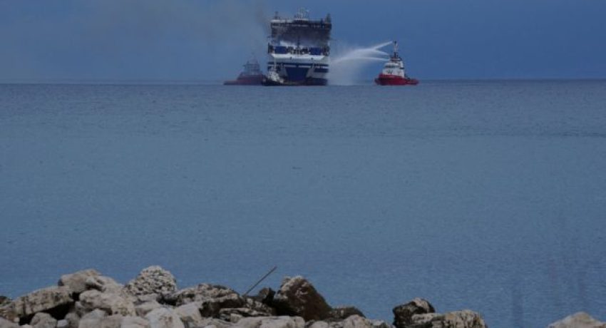 Smoke rises from the Italian-flagged Euroferry Olympia, which sailed from Greece to Italy early on Friday and caught fire, off the coast of the island of Corfu, Greece, February 20, 2022. REUTERS/Stamos Prousalis