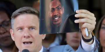 Attorney Bobby DiCello holds up a photograph of Jayland Walker, the man who was shot dead by Akron Police on June 25, as he speaks on behalf of the Walker family during a press conference at St. Ashworth Temple in Akron, Ohio, U.S. June 30, 2022.  Jeff Lange/USA Today Network via REUTERS  NO RESALES. NO ARCHIVES. MANDATORY CREDIT