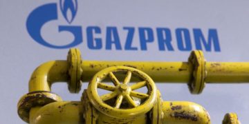 3D printed Natural Gas Pipes are placed on displayed Gazprom logo in this illustration taken, January 31, 2022. REUTERS/Dado Ruvic/Illustration