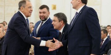 Russian Foreign Minister Sergey Lavrov greets Denis Pushilin, Leonid Pasechnik and Yevgeny Balitsky, who are the Russian-installed leaders in Ukraine's Donetsk, Luhansk and Zaporizhzhia regions, during a ceremony to declare the annexation of the Russian-controlled territories of four Ukraine's Donetsk, Luhansk, Kherson and Zaporizhzhia regions, after holding what Russian authorities called referendums in the occupied areas of Ukraine that were condemned by Kyiv and governments worldwide, in the Georgievsky Hall of the Great Kremlin Palace in Moscow, Russia, September 30, 2022. Sputnik/Mikhail Metzel/Pool via REUTERS ATTENTION EDITORS - THIS IMAGE WAS PROVIDED BY A THIRD PARTY.